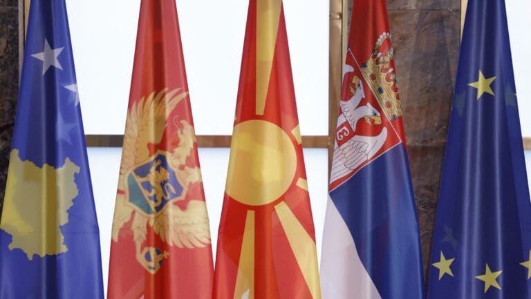 The national flags of (L-R) Kosovo, Montenegro’s North Macedonia, Serbia, and the European Union are set up on a stage for a group photo during the Western Balkans Summit at the Federal Foreign Office in Berlin, Germany, on 21 October 2022