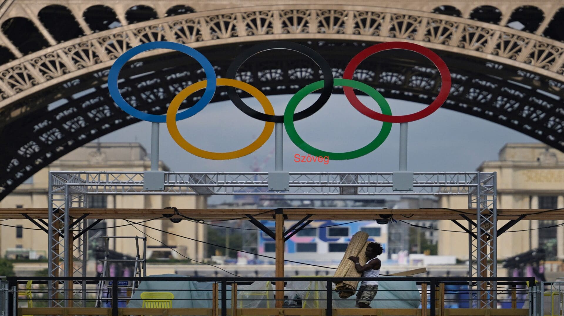 A worker finishes preparations at Eiffel Tower Stadium in Paris on 24 July 2024, ahead of the Paris 2024 Olympic Games.