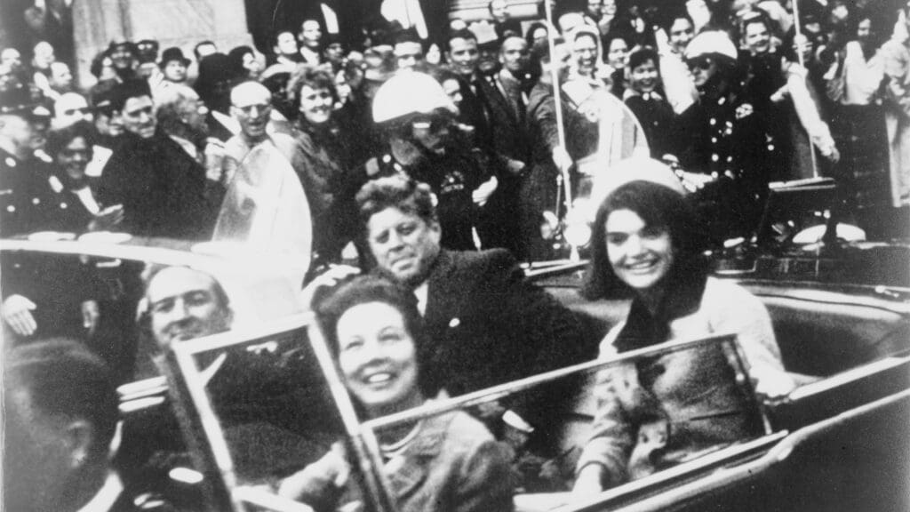 President John F. Kennedy and his wife Jacqueline with Texas Governor John Connally and his wife, Nellie Connally in the presidential limousine just before the assassination on 22 November 1963
