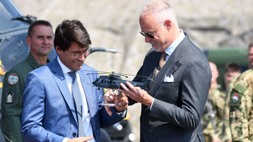 Airbus CEO Bruno Even hands an Airbus H225M helicopter maquette to Hungarian Defence Minister Kristóf Szalay-Bobrovniczky at the handover ceremony of the new Airbus helicopters to the HDF on 24 July 2023 in Szolnok.