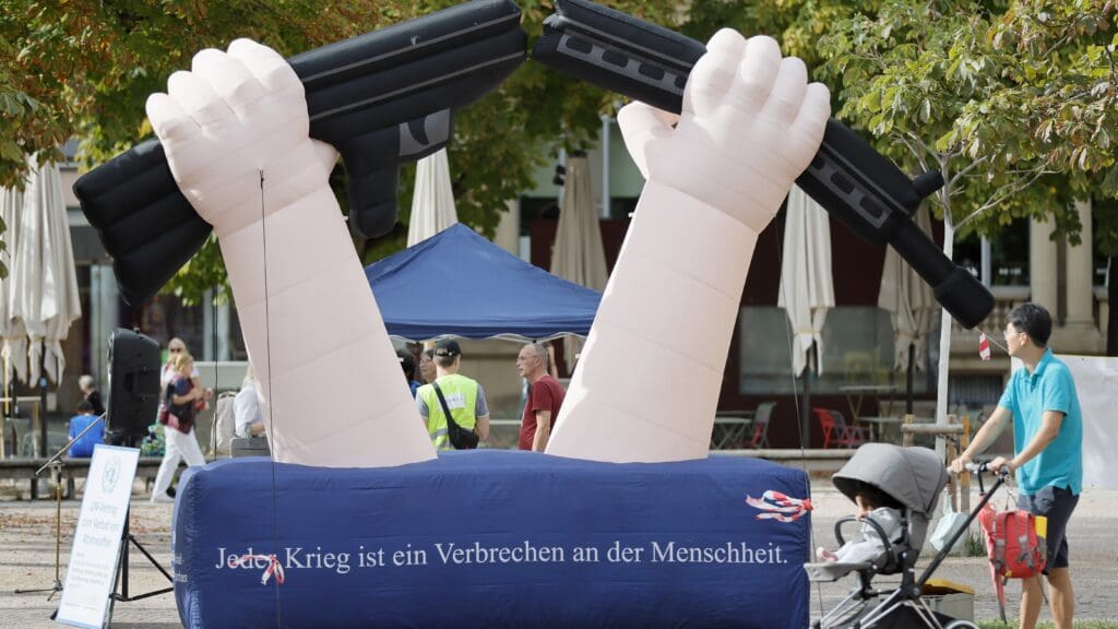 Anti-war demonstration in Karlsruhe, Germany on 23 September 2023. The inscription on the statue says ‘All wars are crimes against humanity.’