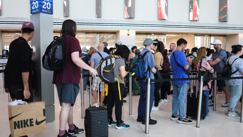 Passengers arrive at security gates of La Guardia airport during Memorial weekend in New York city on 24 May 2024.