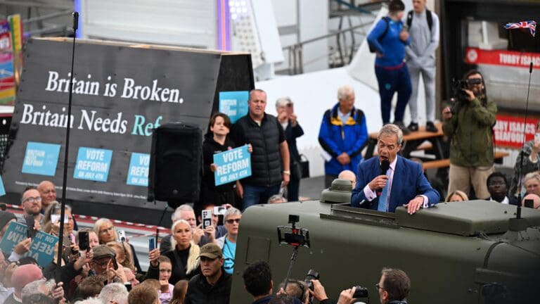 Leader of Reform UK Nigel Farage delivers a speech from the roof of a Land Rover during a general election campaign event by Clacton Pier, in Clacton, South-East England on 3 July 2024.