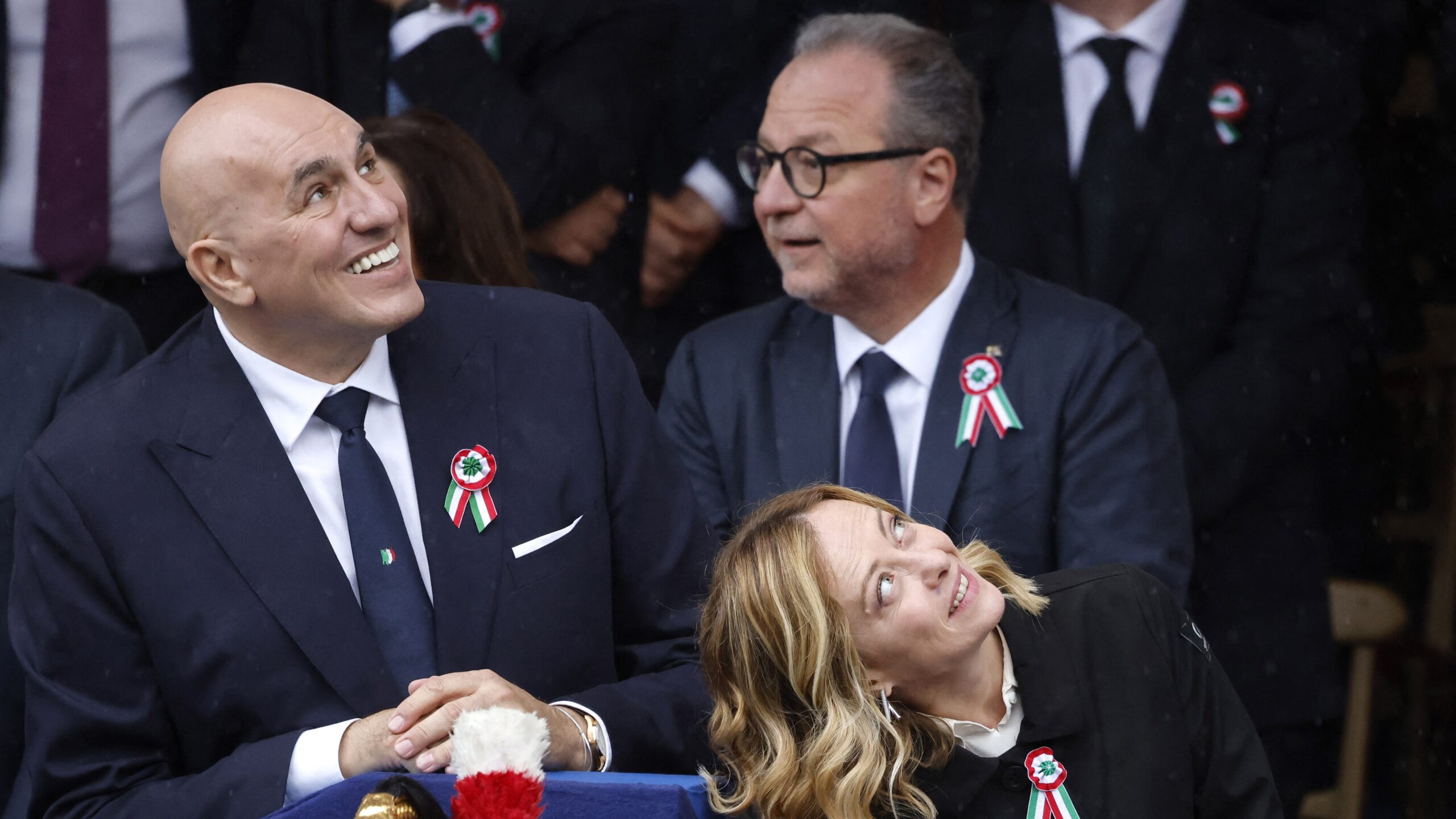 Italian Defence Minister Guido Crosetto (L) and Italian Premier Giorgia Meloni look up during the military parade on the occasion of the Italian Republic Day in Rome, Italy, on 2 June 2024.