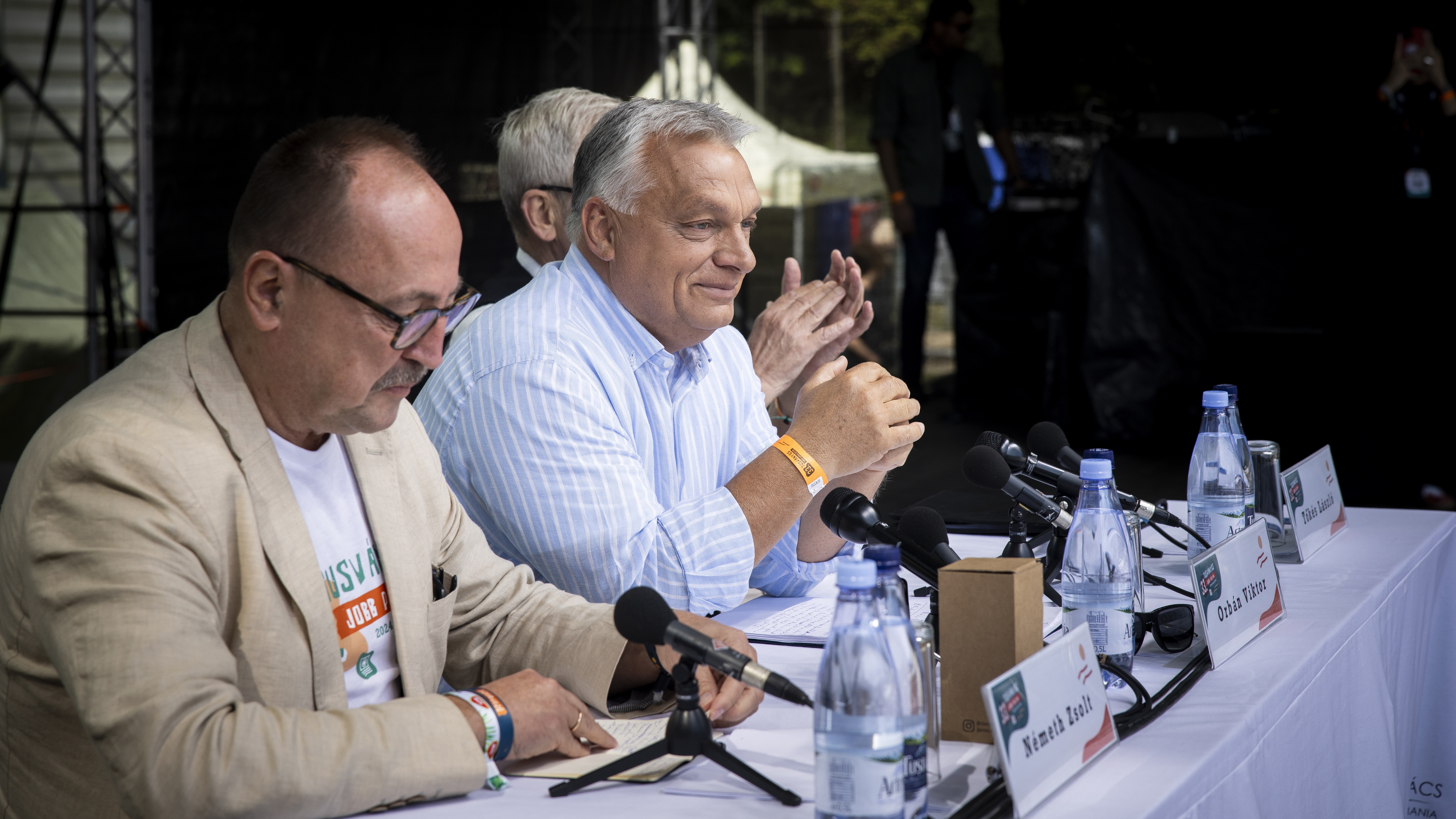 Viktor Orbán delivers his speech in Tusnádfürdő, Transylvania on 27 July 2024. To his left, Chairman of the Foreign Affairs Committee of the National Assembly Zsolt Németh, to his right László Tőkés, President of the Hungarian National Council of Transylvania (EMNT)