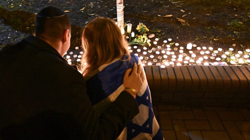 People light candles after a ceremony of commemoration for the victims of the 7 October Hamas terrorist attack at a synagogue in Budapest, Hungary on 7 October 2024.