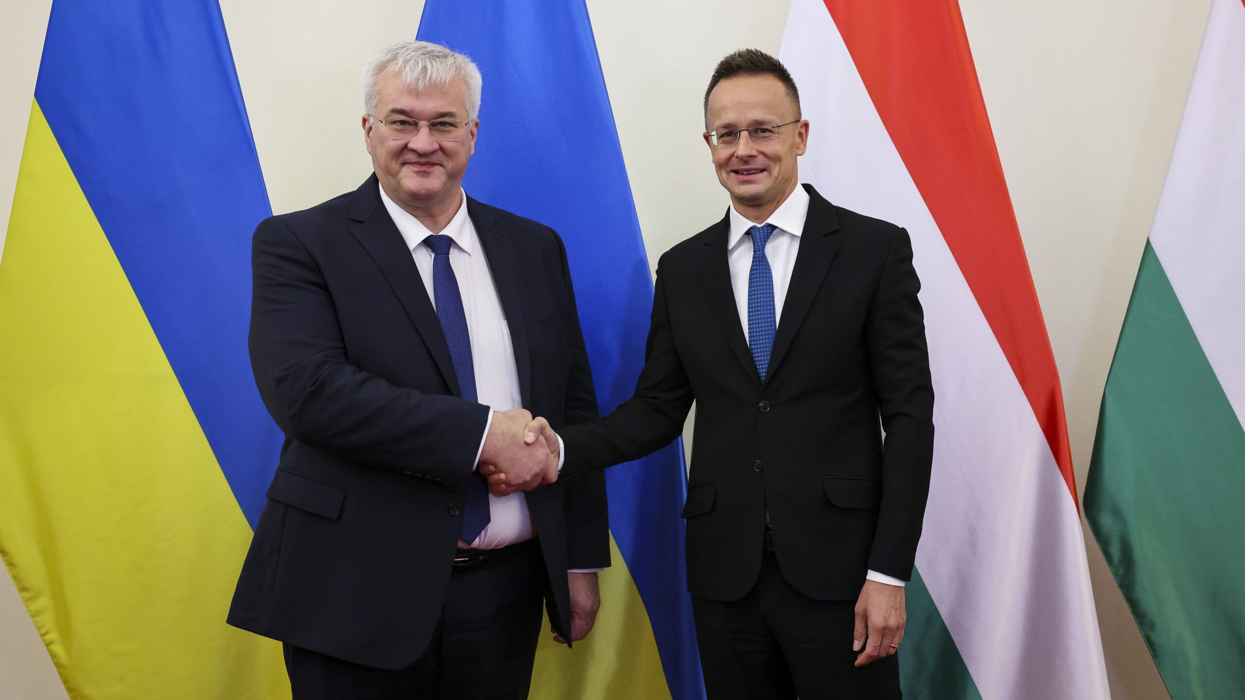 Ukrainian Foreign Minister Andrii Sybiha (L) shakes hands with Hungarian Minister of Foreign Affairs and Trade Péter Szijjártó on 30 September 2024 in Budapest.