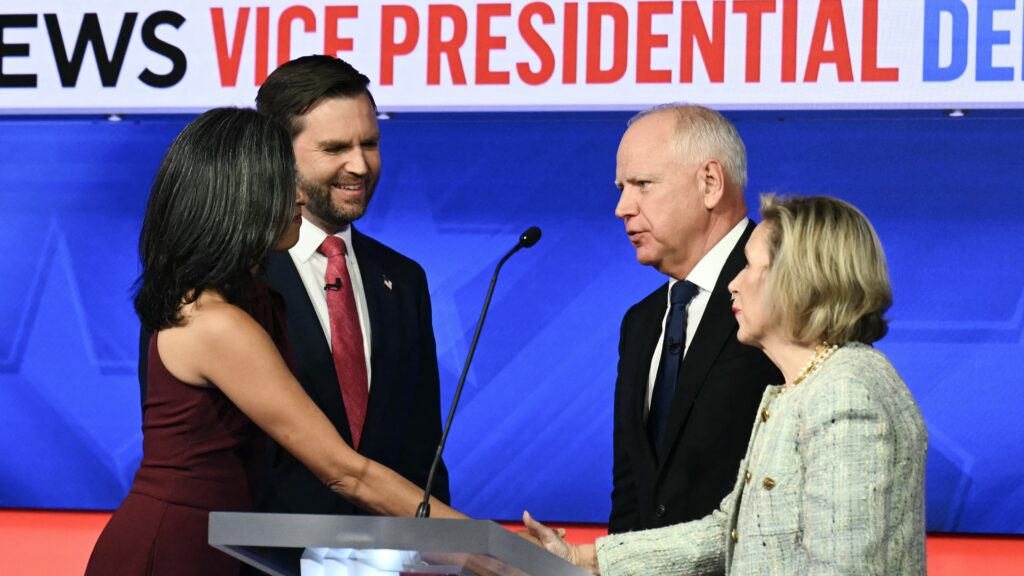 US Senator and Republican vice presidential candidate JD Vance and his wife Usha Vance greet Minnesota Governor and Democratic vice presidential candidate Tim Walz and his wife Gwen Walz at the end of the Vice Presidential debate on 1 October 2024.