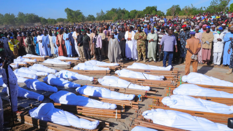 People attend a funeral for those killed by suspected Boko Haram militants in Zaabarmar, Nigeria, on November 29 2020.