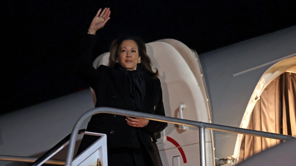 US Vice President and Democratic presidential candidate Kamala Harris waves as she boards from Air Force Two at LaGuardia Airport in Queens, New York, on 2 November 2024.