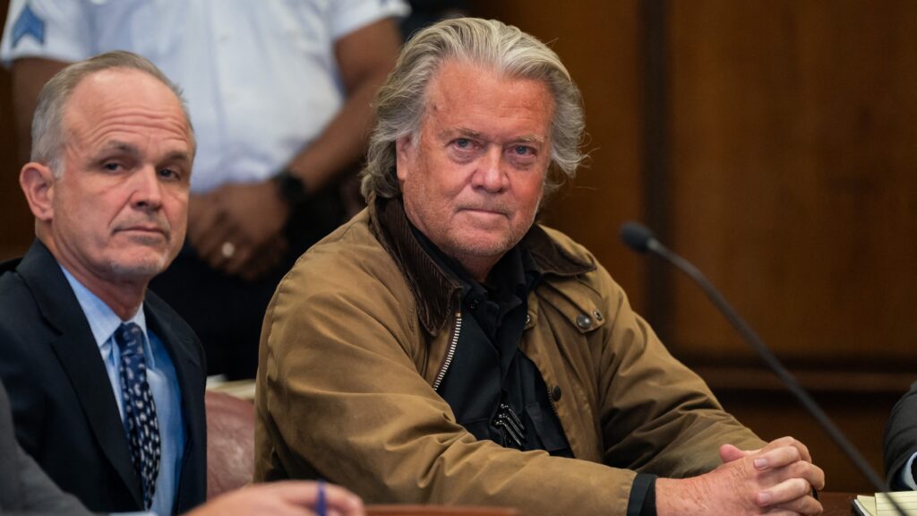 Former political advisor to US President-elect Donald Trump Steve Bannon (R) at his court hearing at the Manhattan Criminal Court in New York City on 12 November 2024.