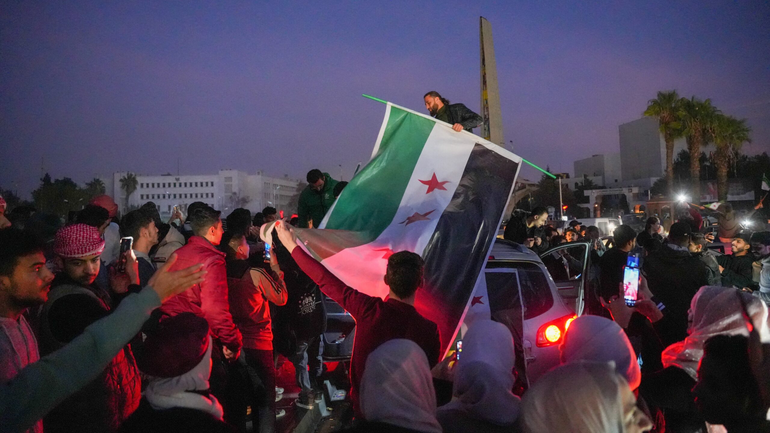 Syrians Gather In The Umayyad Square In The Heart Of Damascus To Celebrate The Fall Of The Assad Regime On December 9, 2024.(Photo by Rami Alsayed/NurPhoto) (Photo by Rami Alsayed / NurPhoto / NurPhoto via AFP)