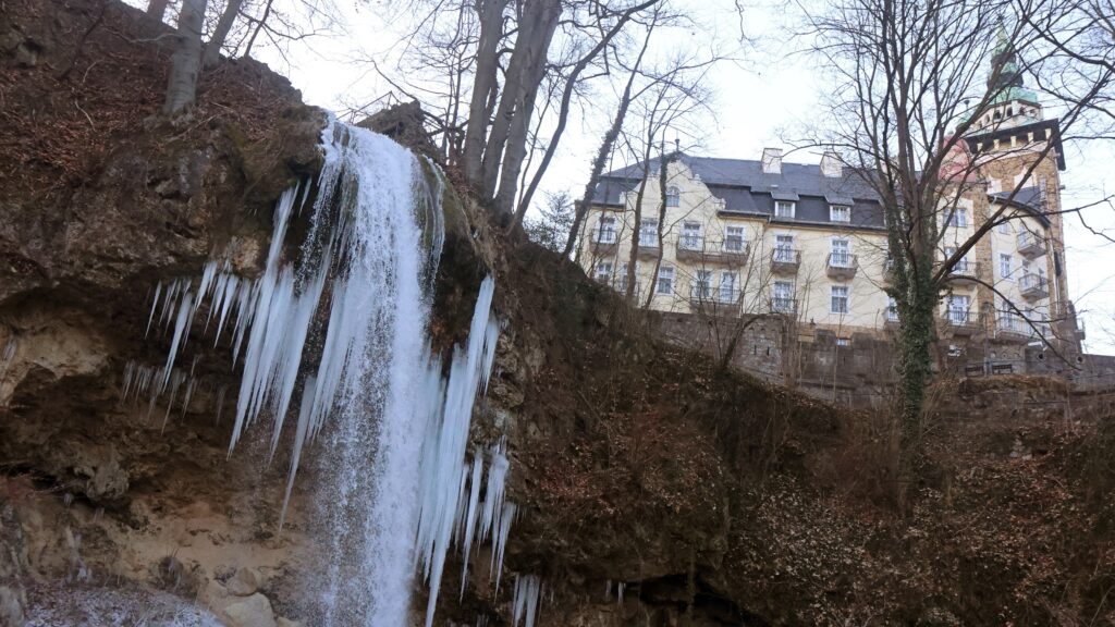 The partially frozen waterfall at Lillafüred, with the Hotel Palota in the background