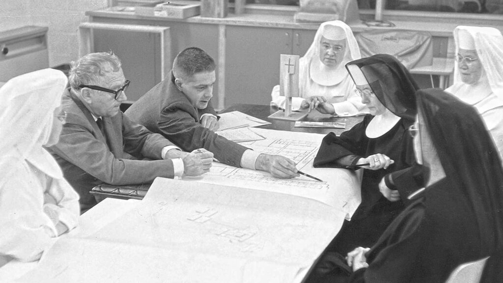 Benedictine Sisters of Mary College meeting with the internationally renowned architect, Marcel Breuer, in the early design process of their campus and monastery in 1950.